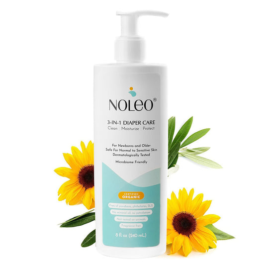 A pump bottle of NOLEO 3-in-1 Diaper Care Cream with sunflowers in the background, indicating a natural approach to baby care.
